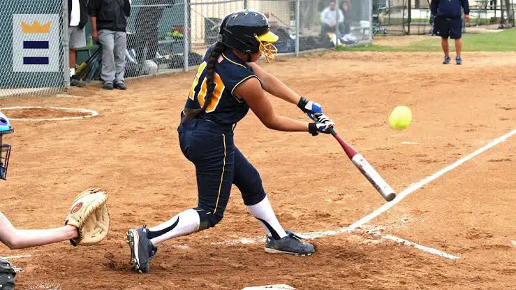 High school softball game batting team