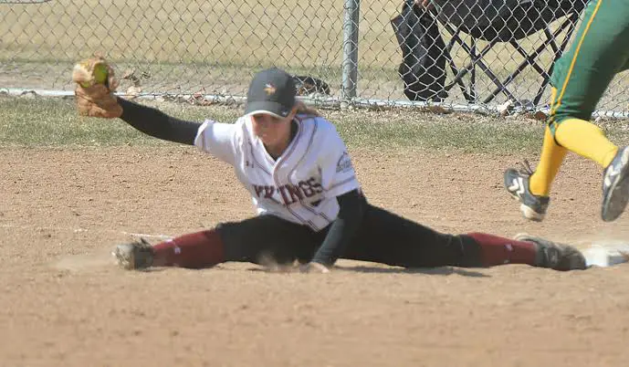 Left handed softball player playing first base